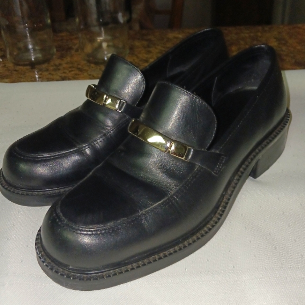 Black loafers with silver bar embellishment.  Size 6